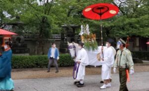 A white horse bears symbolic representations of deities in a sacred Gion Festival 2020 procession.