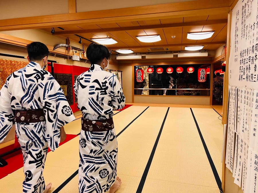 A large room at the famous Naginata Boko float, with just two people in it during covid restrictions. Gion Festival, Kyoto.