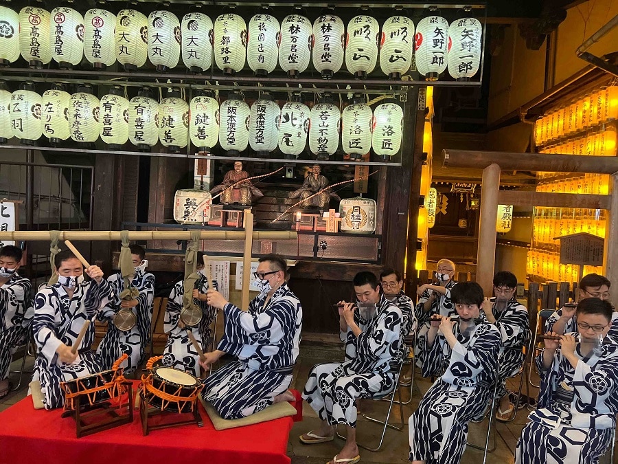 Gion Matsuri musicians play in front of the otabisho shrine.