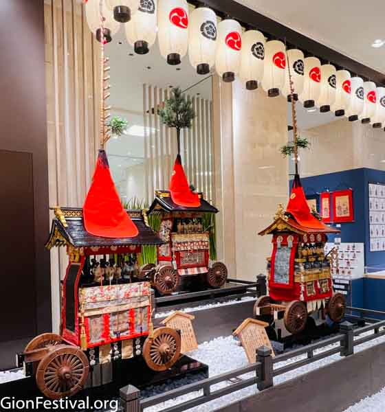 Three smaller, antique versions of the Gion Festival yamaboko floats on display at Daimaru department store.