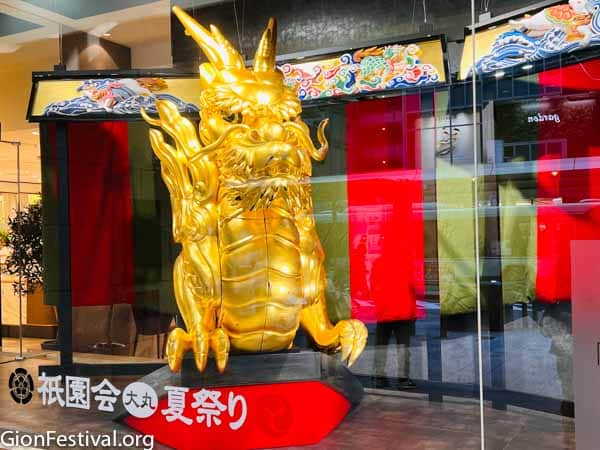 Ofune Boko's recently gilded dragon sculpture in the window of Daimaru Department store during the Saki Matsuri.