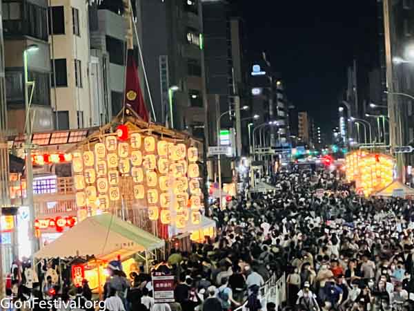 Lighted lanterns on Gion Festival floats amidst crowded central Kyoto streets during Gion Festival's yoiyama street party on July 16.