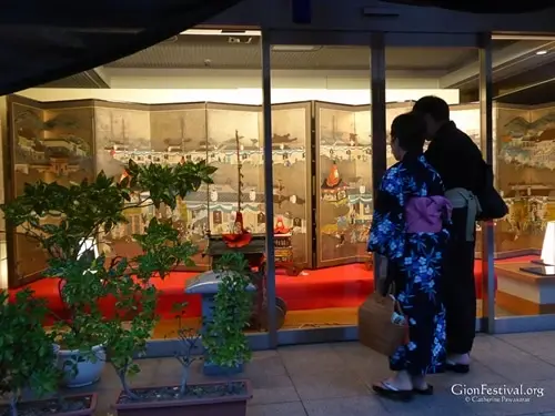 yukata couple enjoy the Gion Festival's byobu matsuri folding screen company lobby gion festival kyoto japan